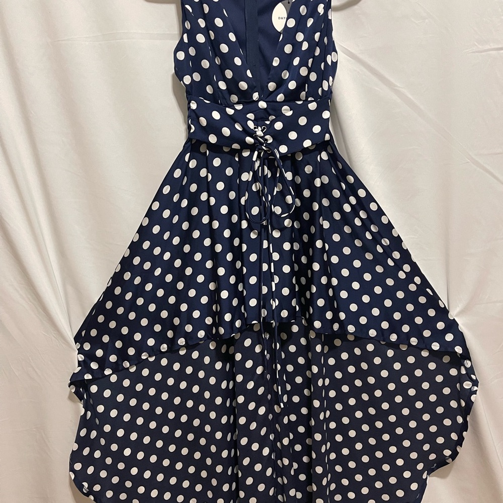 Never worn dress. Designer unknown - label says “Day & Night’. Size Small